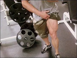 Legs pushing a leg press machine